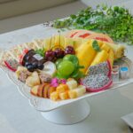 “바쁜 일상 속 건강 지키기, 영양과 보충제로 실천하는 새로운 습관” a platter of fruit and cheese on a table